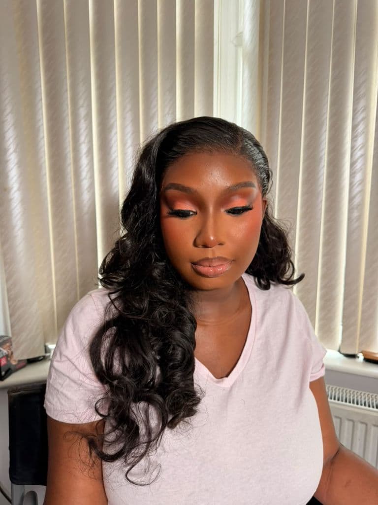 Warm coral and orange editorial-inspired eye look